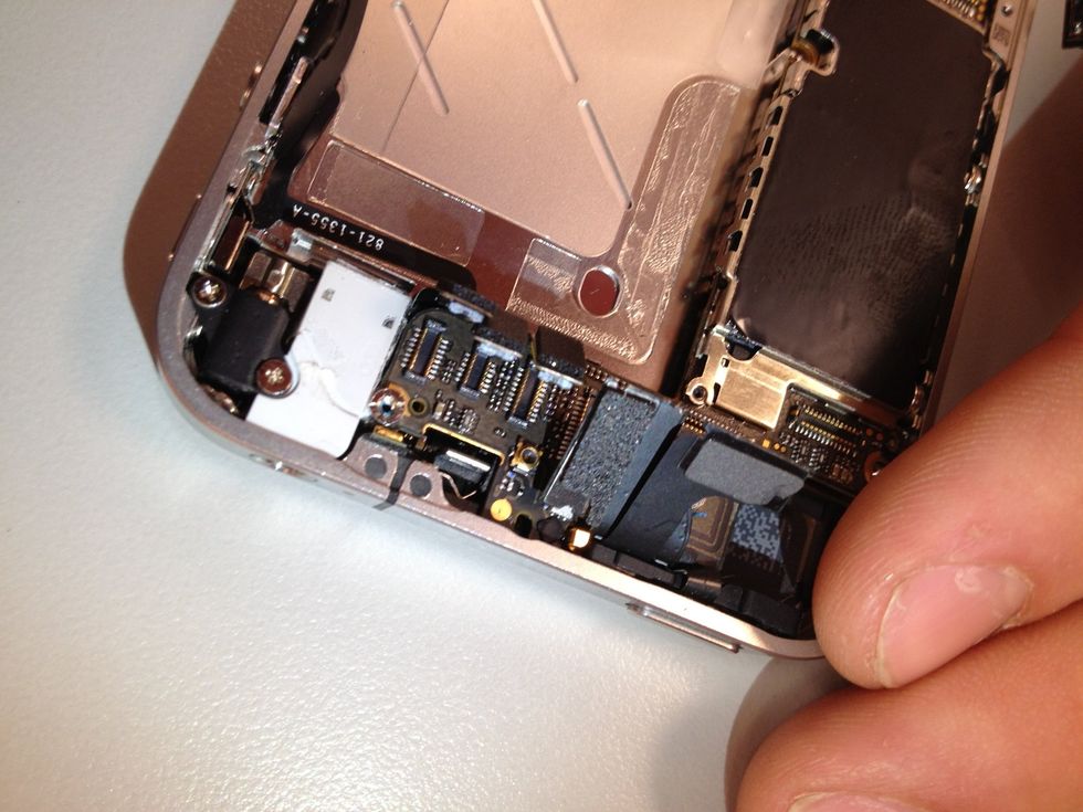 Directly above the front camera connector (the last one in the row) is a small flathead screw. 4.8 mm. That will need to be removed also.