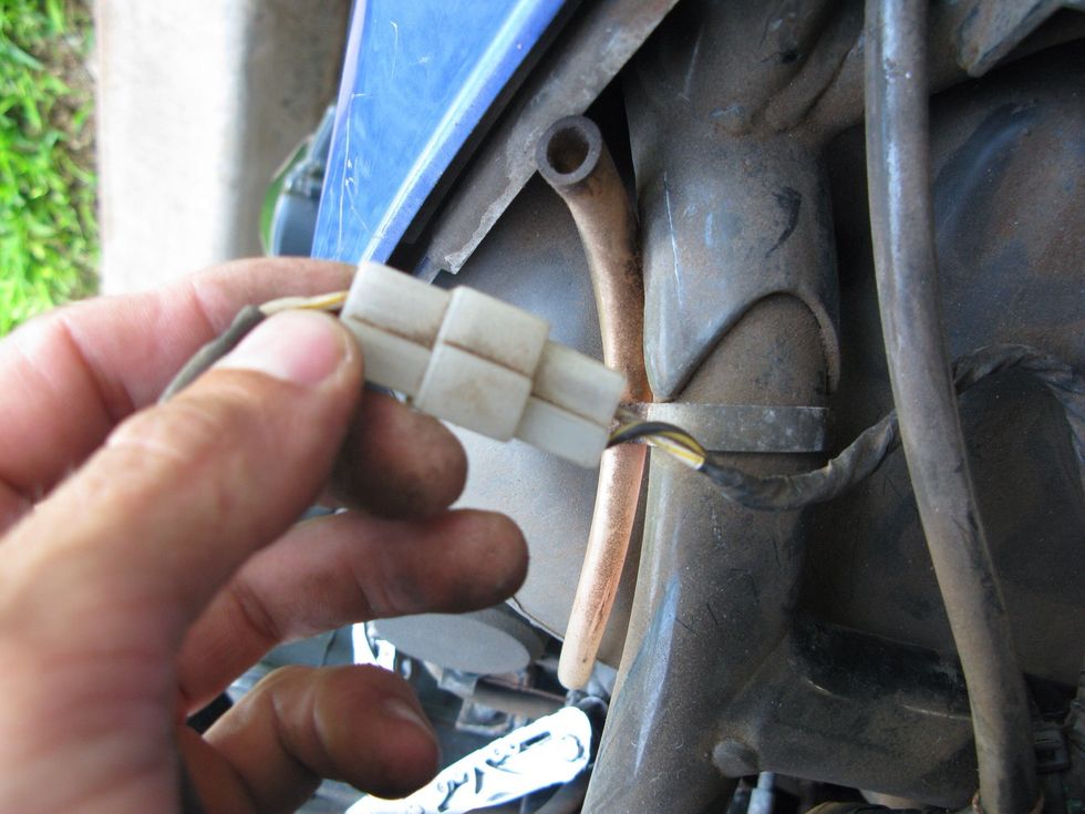 Disconnect the fuel gauge. Be careful to pull on the connector and not the wires.