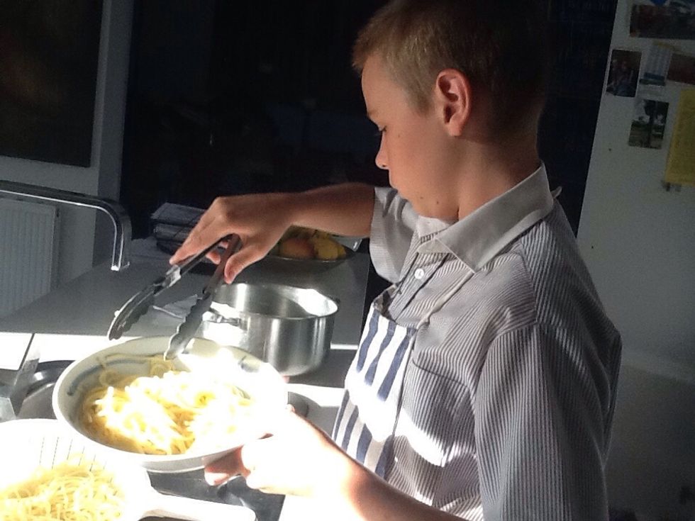 Dishing up the pasta.
