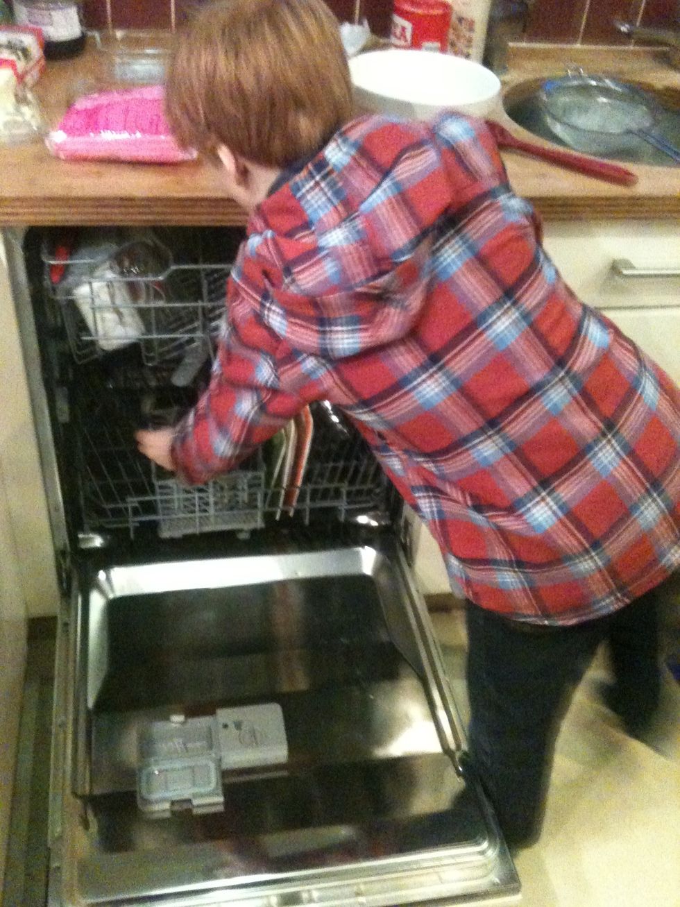 Dishwasher filled while a lovely smell comes from the oven.