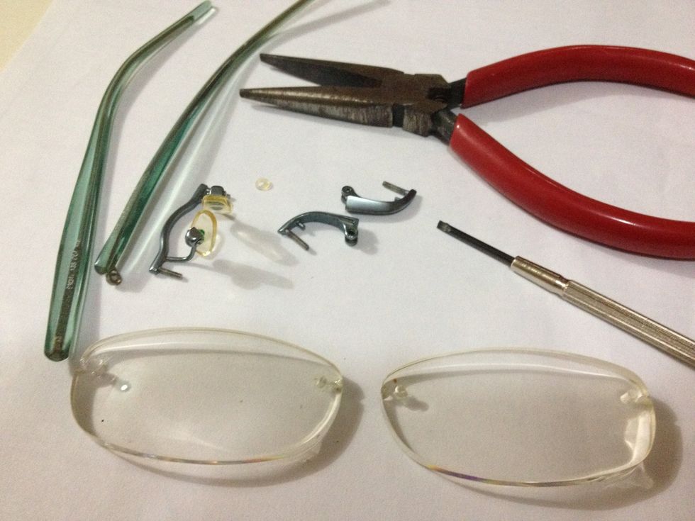 Dissemble the glasses. Glass lens are better but plastic ones should work. Be careful not to scratch the lens.