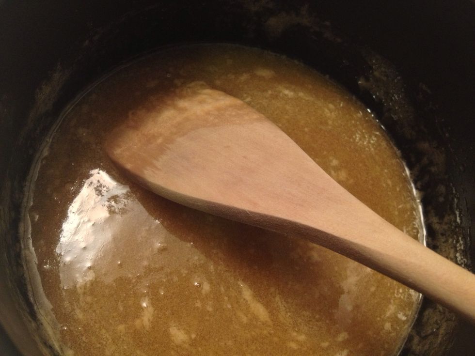 Dissolve the bicarbonate of soda in boiling water add to the melted butter mixture. It may foam a little.