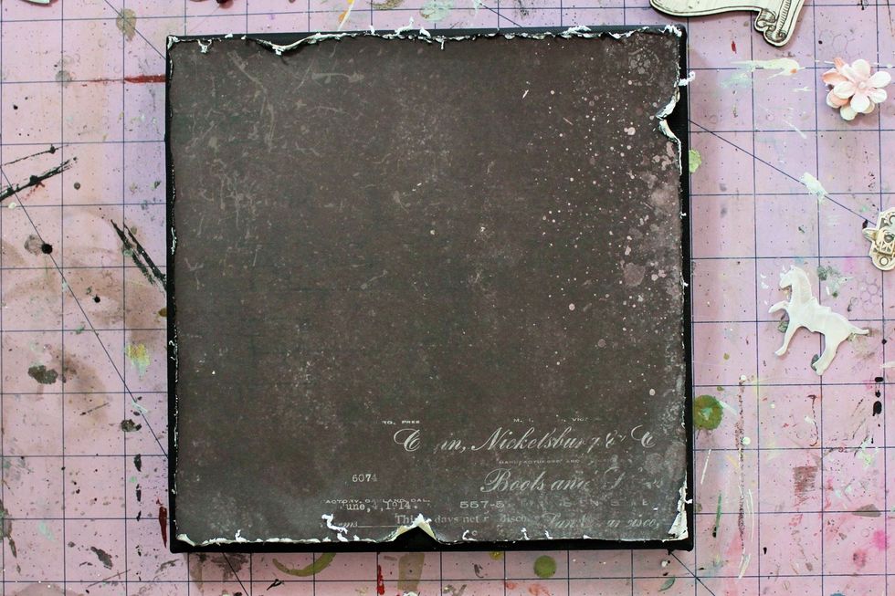 Distress the edges before adhering to the canvas.