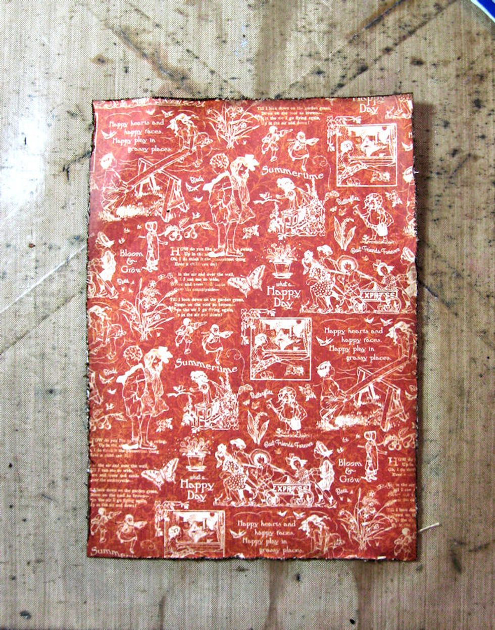 Distress the edges of a 4.5" x 6.5" piece of brown cardstock. Glue the card panel to the brown cardstock. Cut, distress and ink 5x7 panel of July paper.