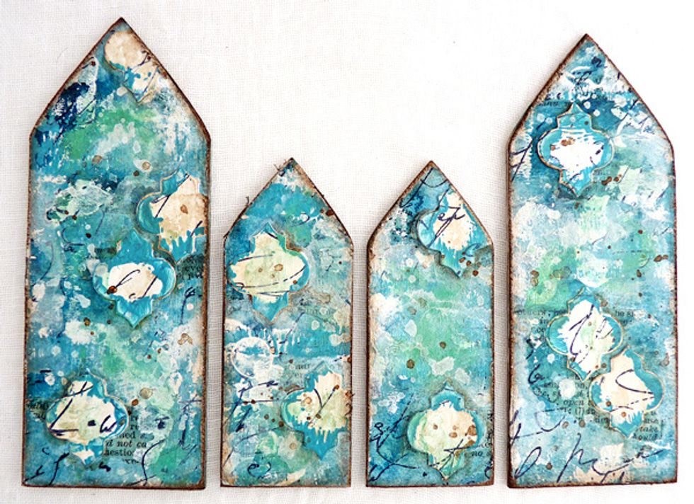 Distress the edges of the smaller pieces with a distressing tool or sanding block and blend in brown distress ink.