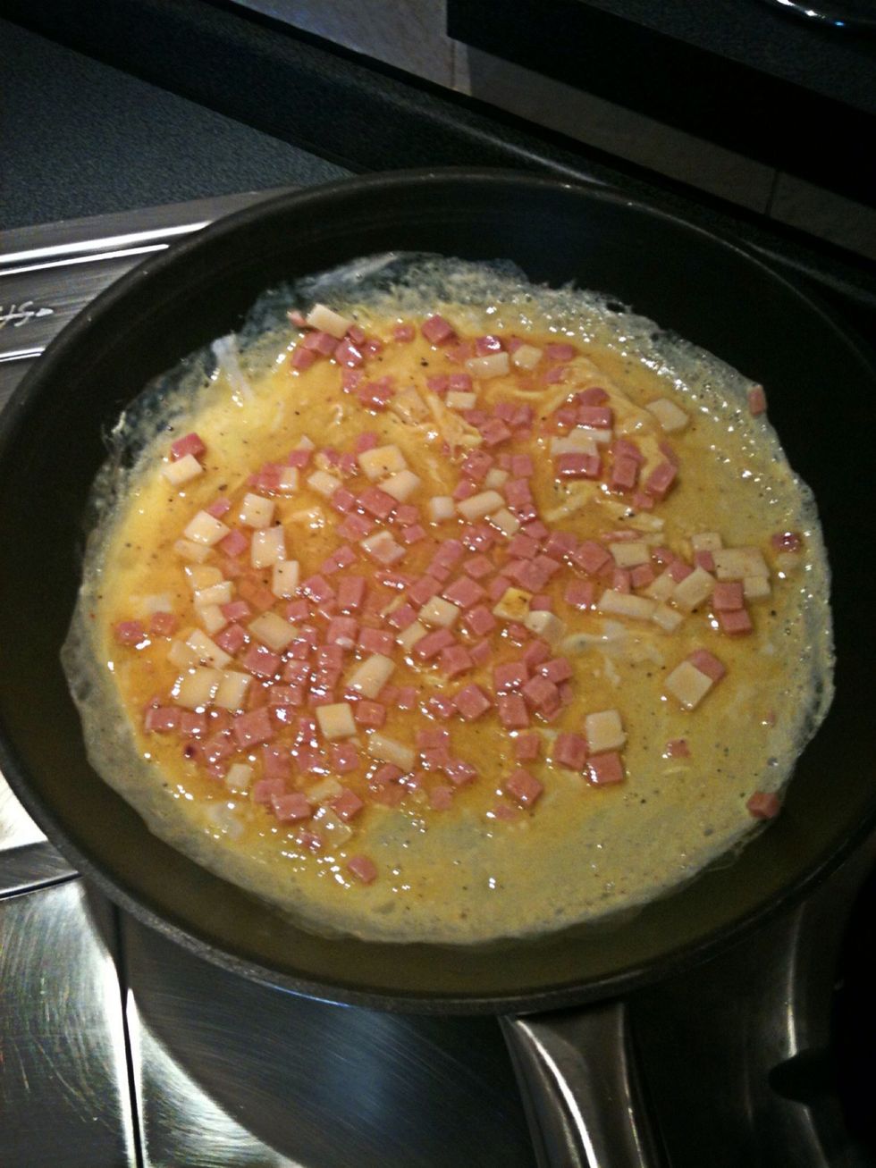 Distribute the contents of the bowl into the pan uniformly