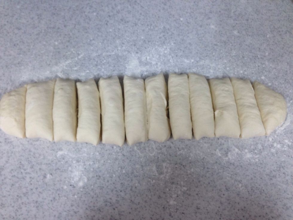 Divid the dough to 12 pieces .
