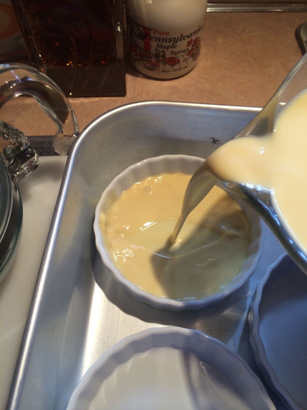 Divide custard between the 6 dishes.
