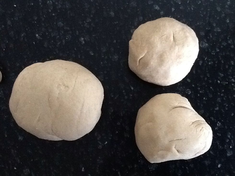 Divide dough in half and set one half aside for second bear. Divide remaining dough in half. One of these halves will be the body. Divide second half in two, one for head and one for arms and legs.
