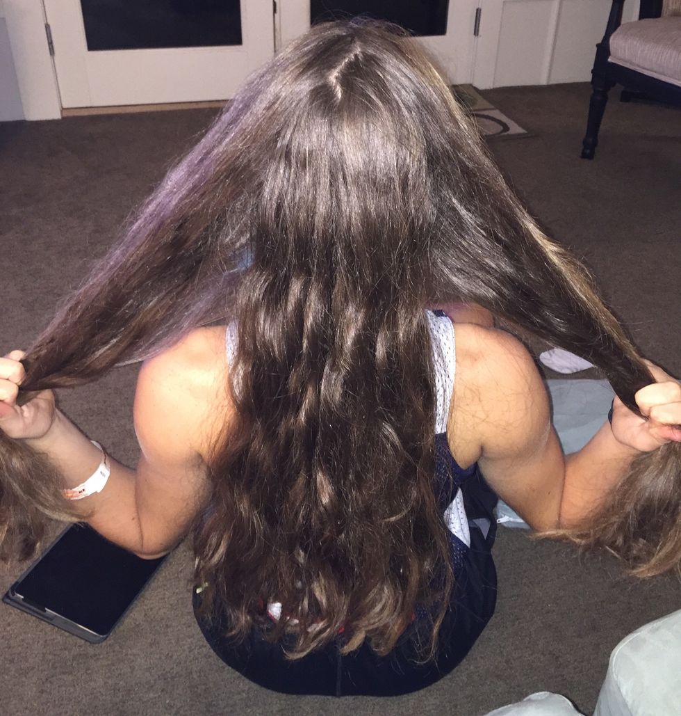 Divide hair into three equal sections.