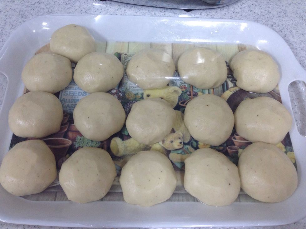 divide  the dough into 16  equal parts and let them rest .