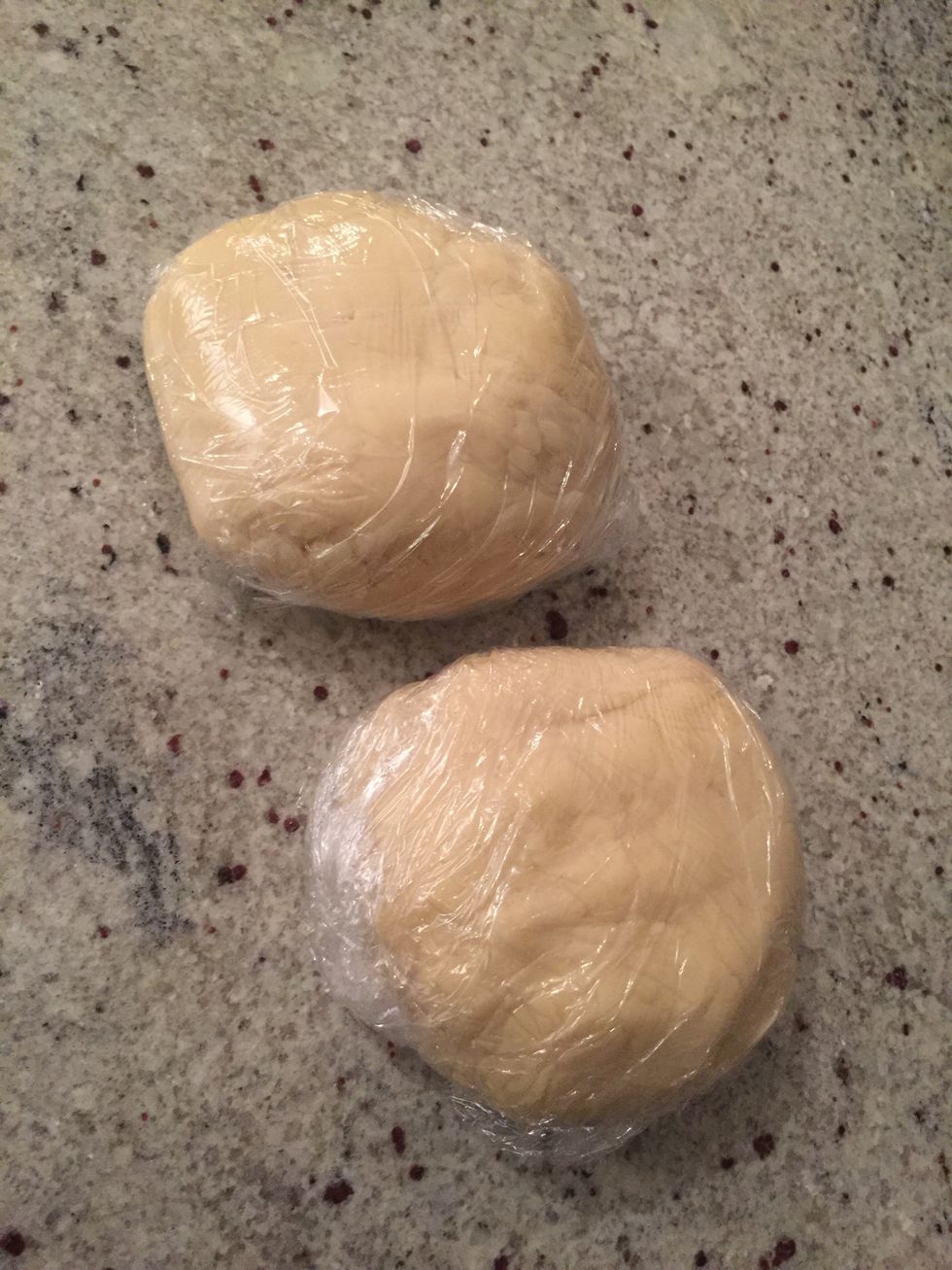 Divide the dough into two parts and wrap. Then let chill in the fridge for at least 2 hours