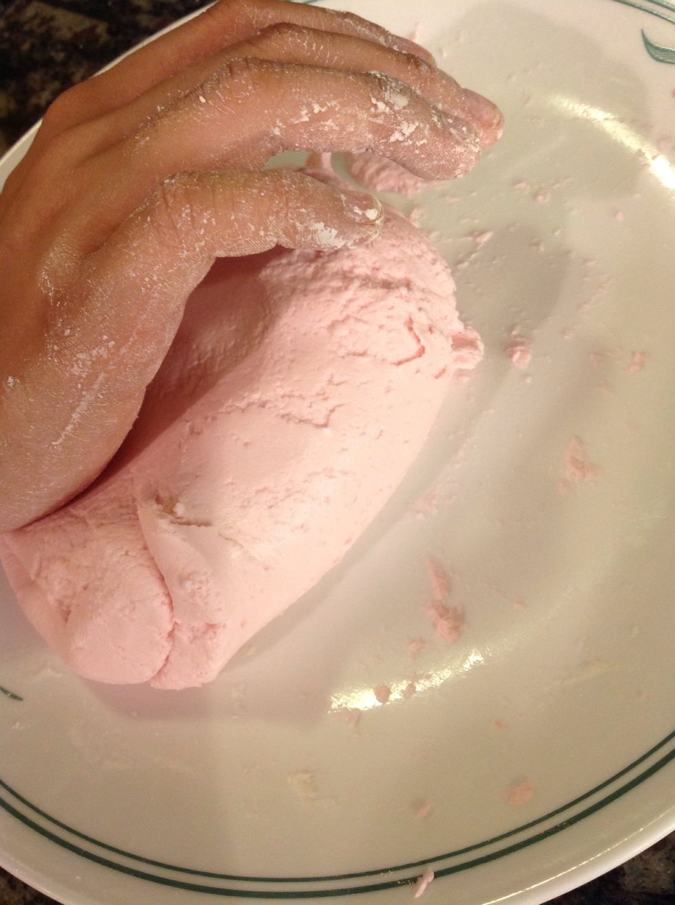 Divide the other potion by the number of colors you want to use. Add at least two drops and knead until the color is consistent throughout dough.