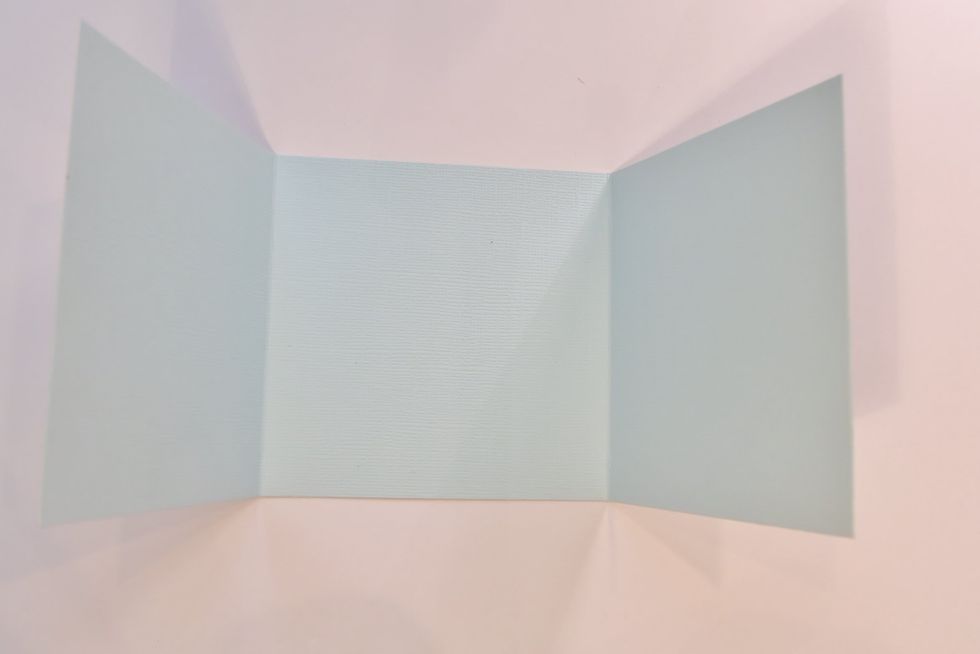 Divide the rectangle into thirds by scoring the 12" side of the paper at 4" and at 8" -these will be valley folds.