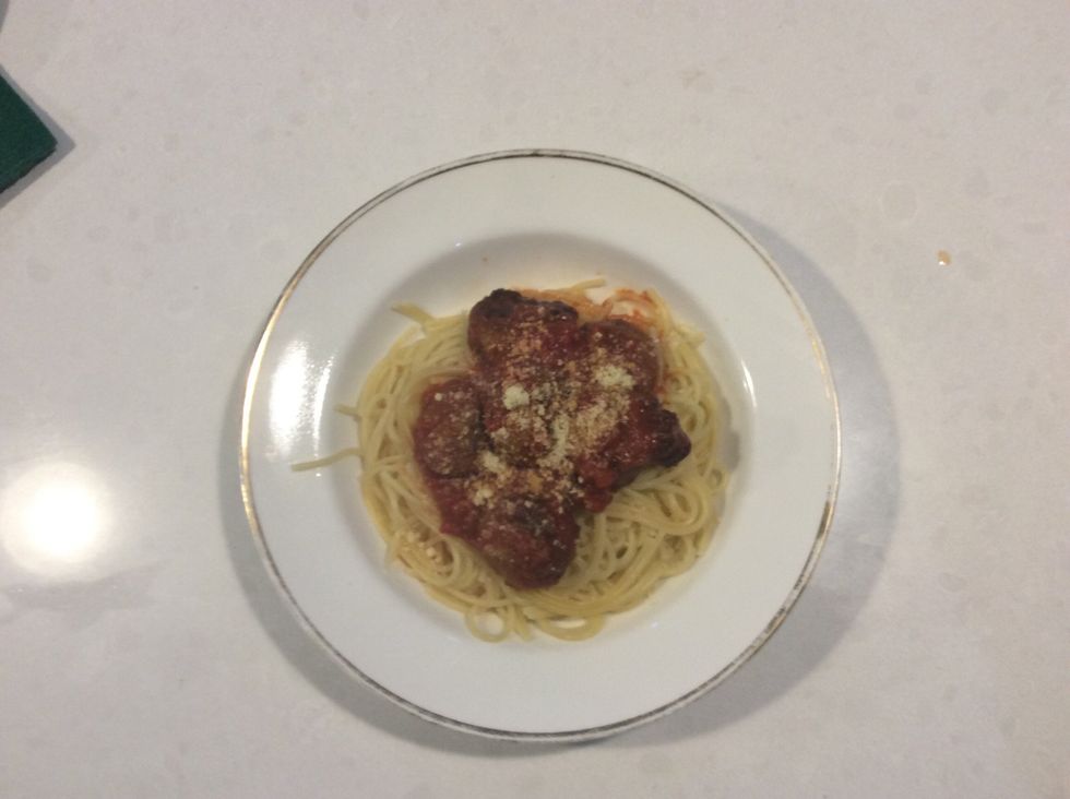 Divide the spaghetti among serving bowls. Top with meatballs and tomato sauce. Serve topped with shaved parmesan.
