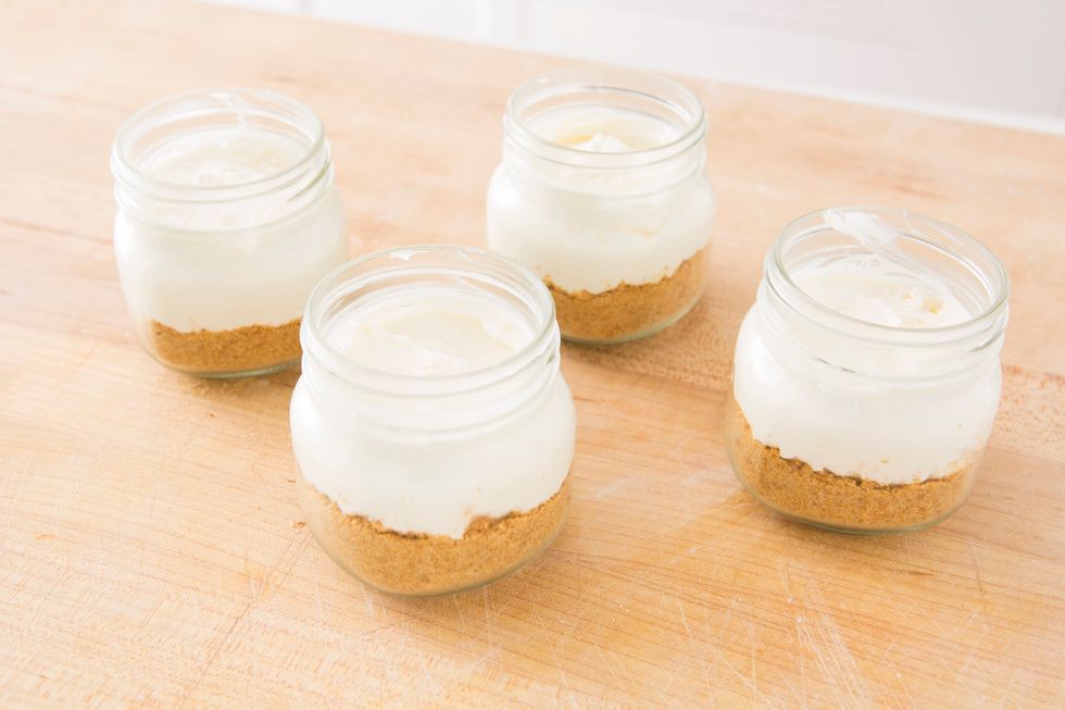 Divide your cream cheese mixture between the jars, layering over your graham cracker crust. Then, refrigerate for 3-4 hours.
