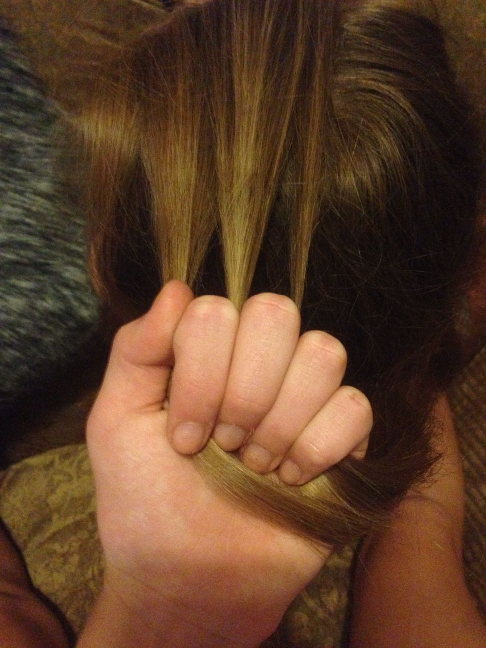 Divide your hair into 3 parts.