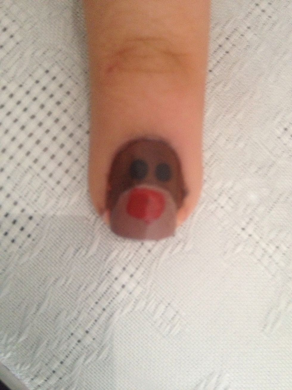 Do a big red dot on the reindeer nail. This will be his red nose.