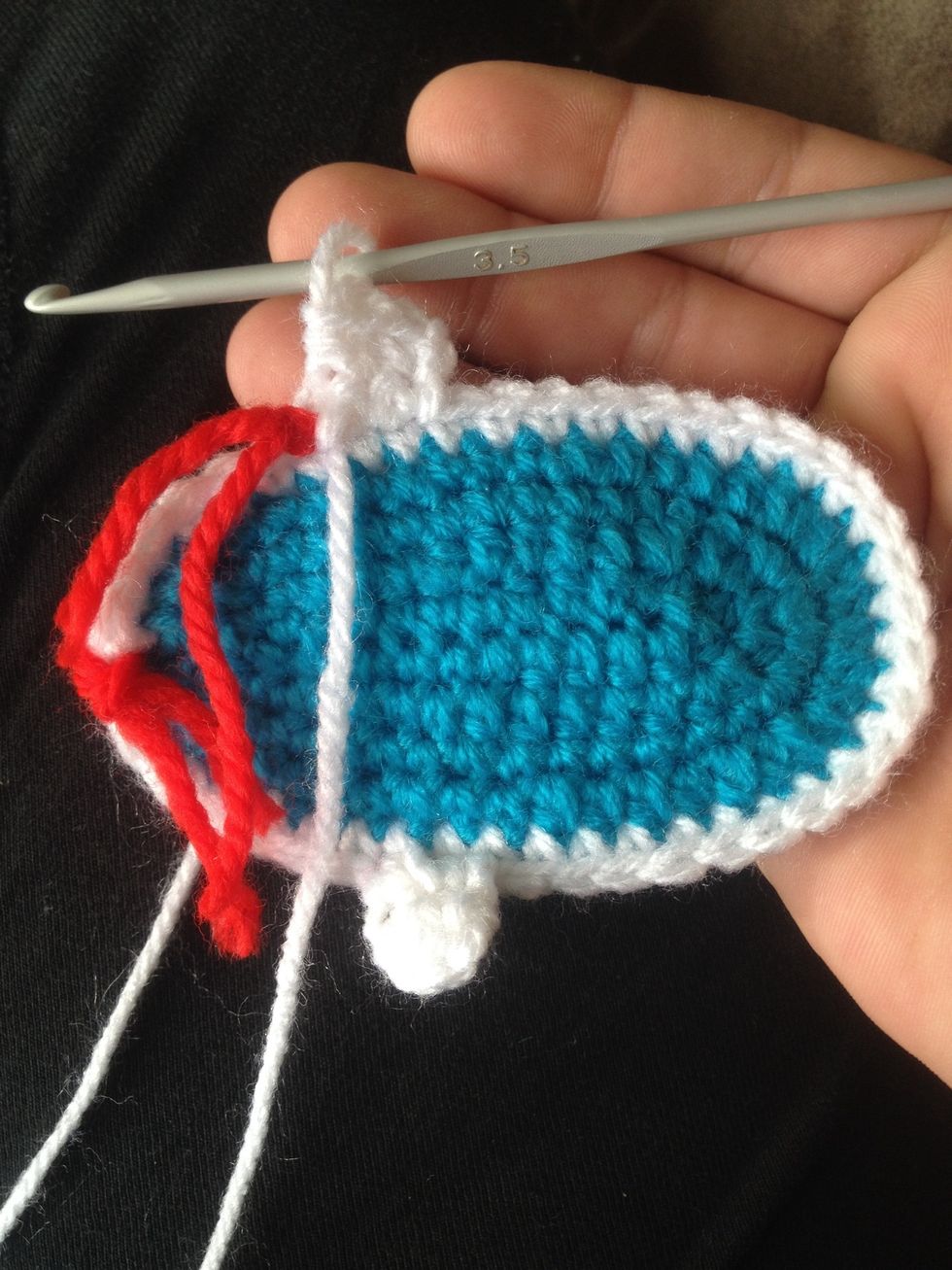 Do a half double crochet in the next 2 stitches and then turn