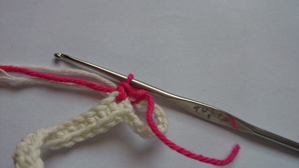 Do a single crochet with the second colour.