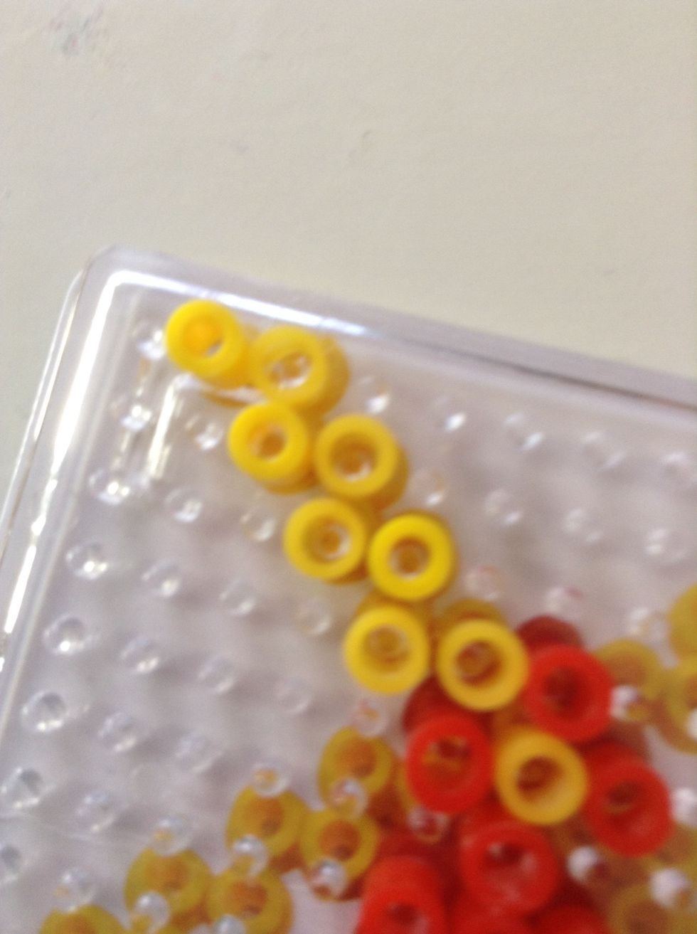 Do a zigzag of yellows. Please do it 3 more times.