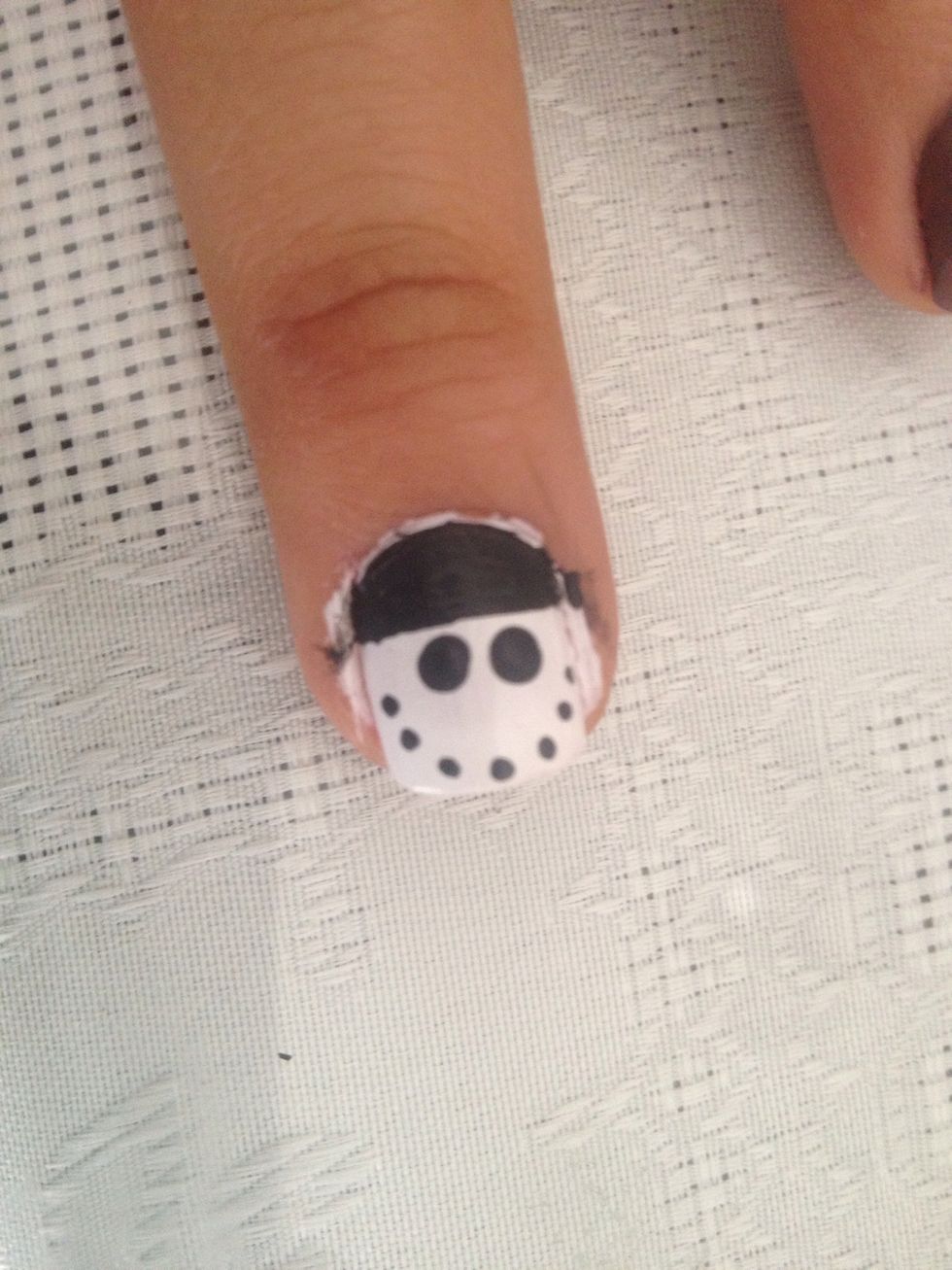Do little dots on the snowman nail as his smile