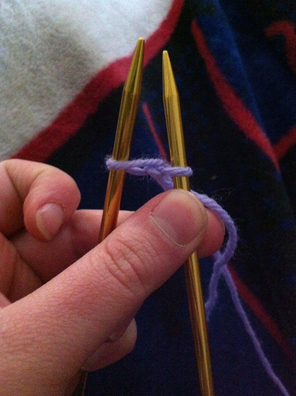 Do not remove the stitch off of the left needle.