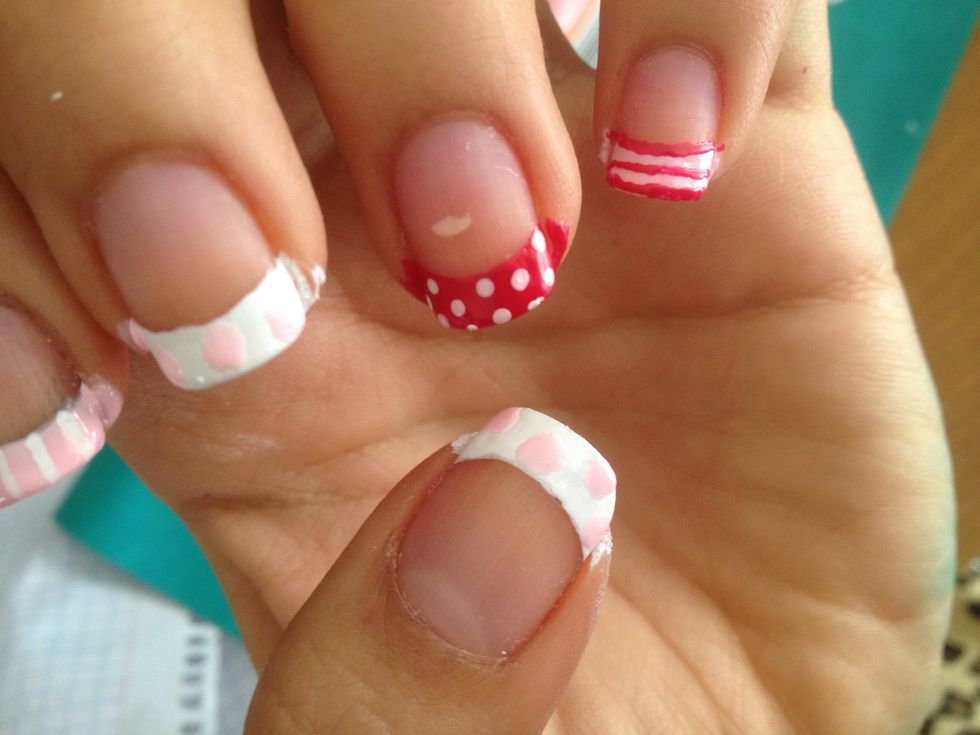Do some big light pink dots on the nails that have white nail polish