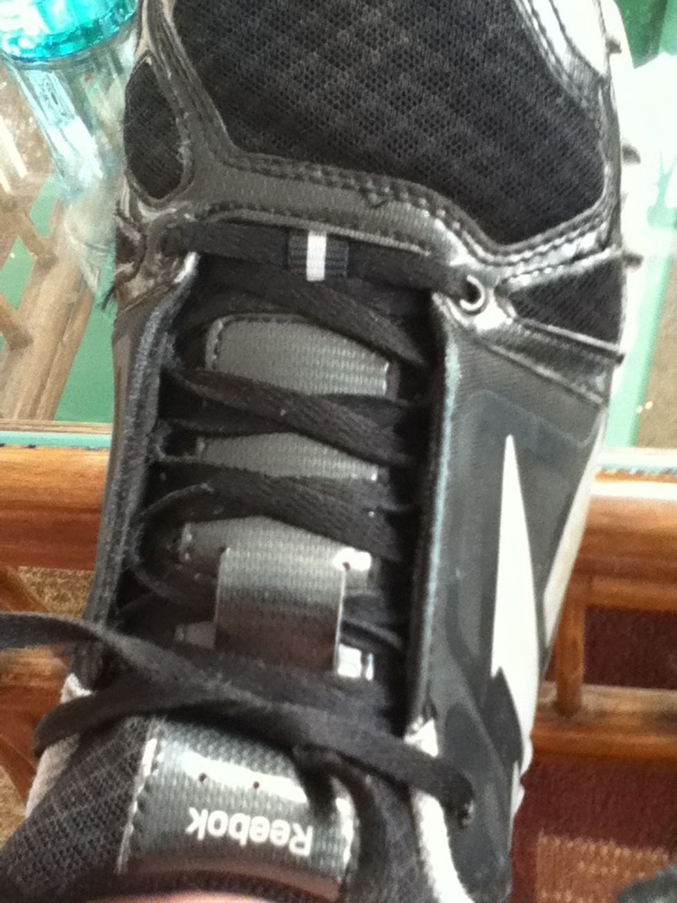 Do the first knot  you always do when tying your shoes.