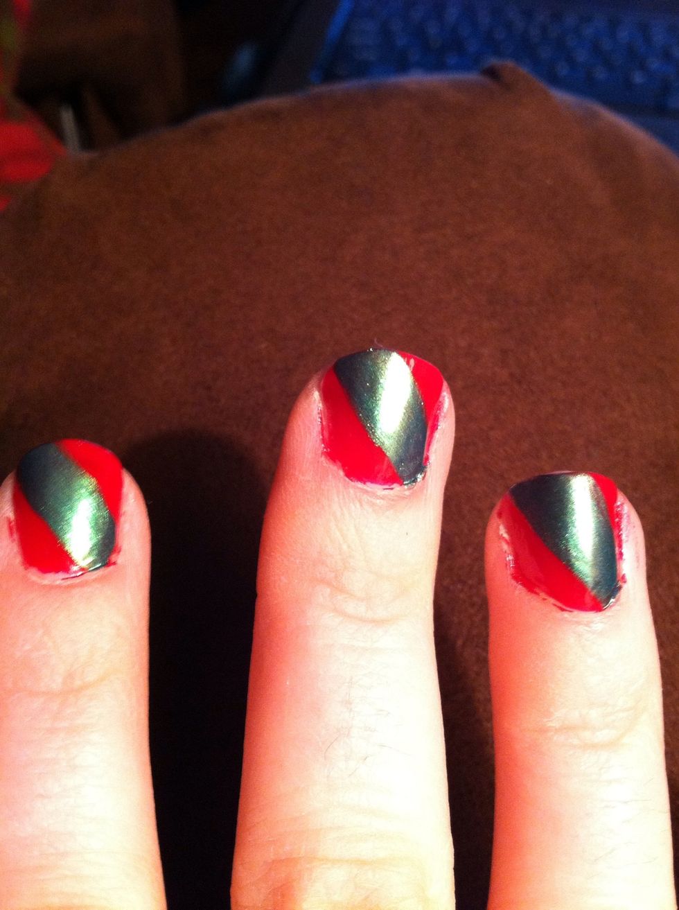 Do the opposite (sweep bottom right to top left of nail) on the right hand. You may have to apply several green coats to make the color pop.