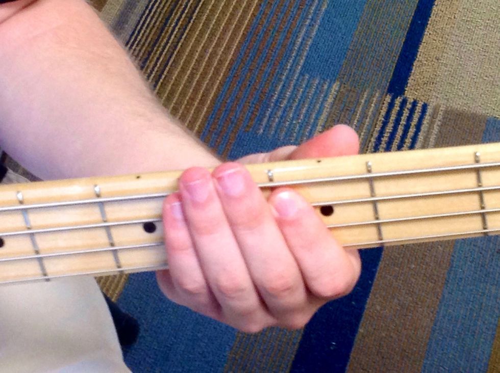 Do the same as in step two, except place your finger between the second and third fret. This is the second note in the scale, C.