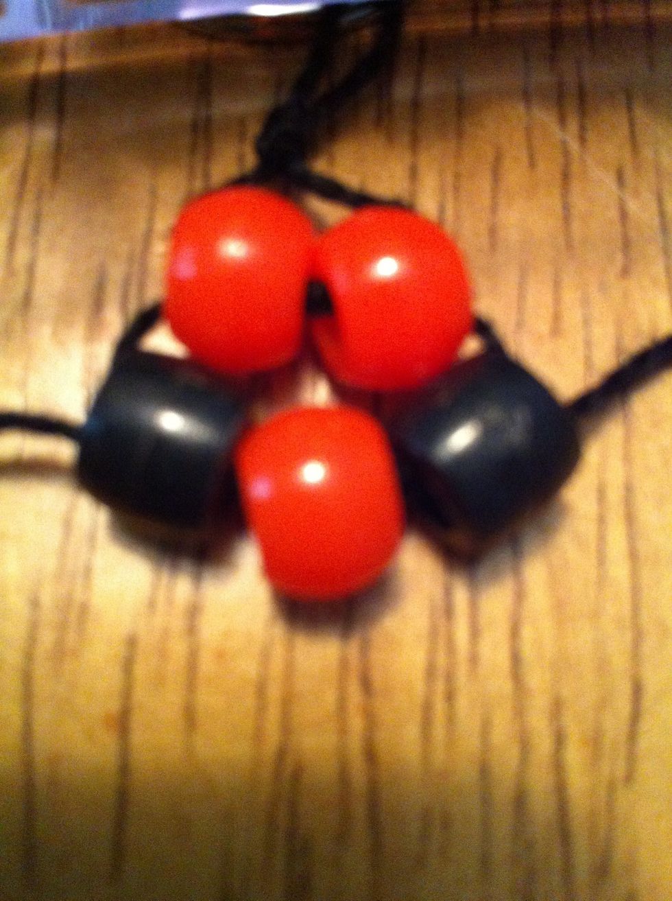 Do the same method. Put that layer on one of the strings, slip the other string through, then pull up. Now you should have this.