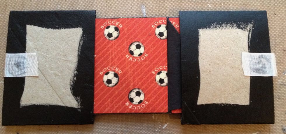 Do the same on the other side and pull the stand inside. Glue paper on the paper roll ends.