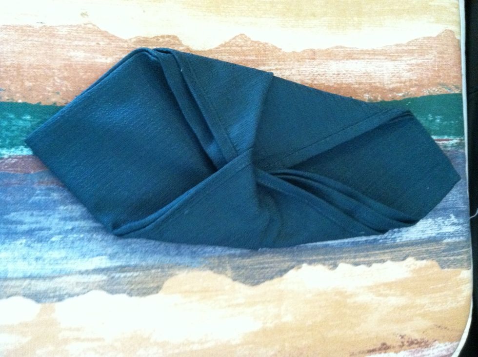 Do the same on the other side and tuck one corner into the other