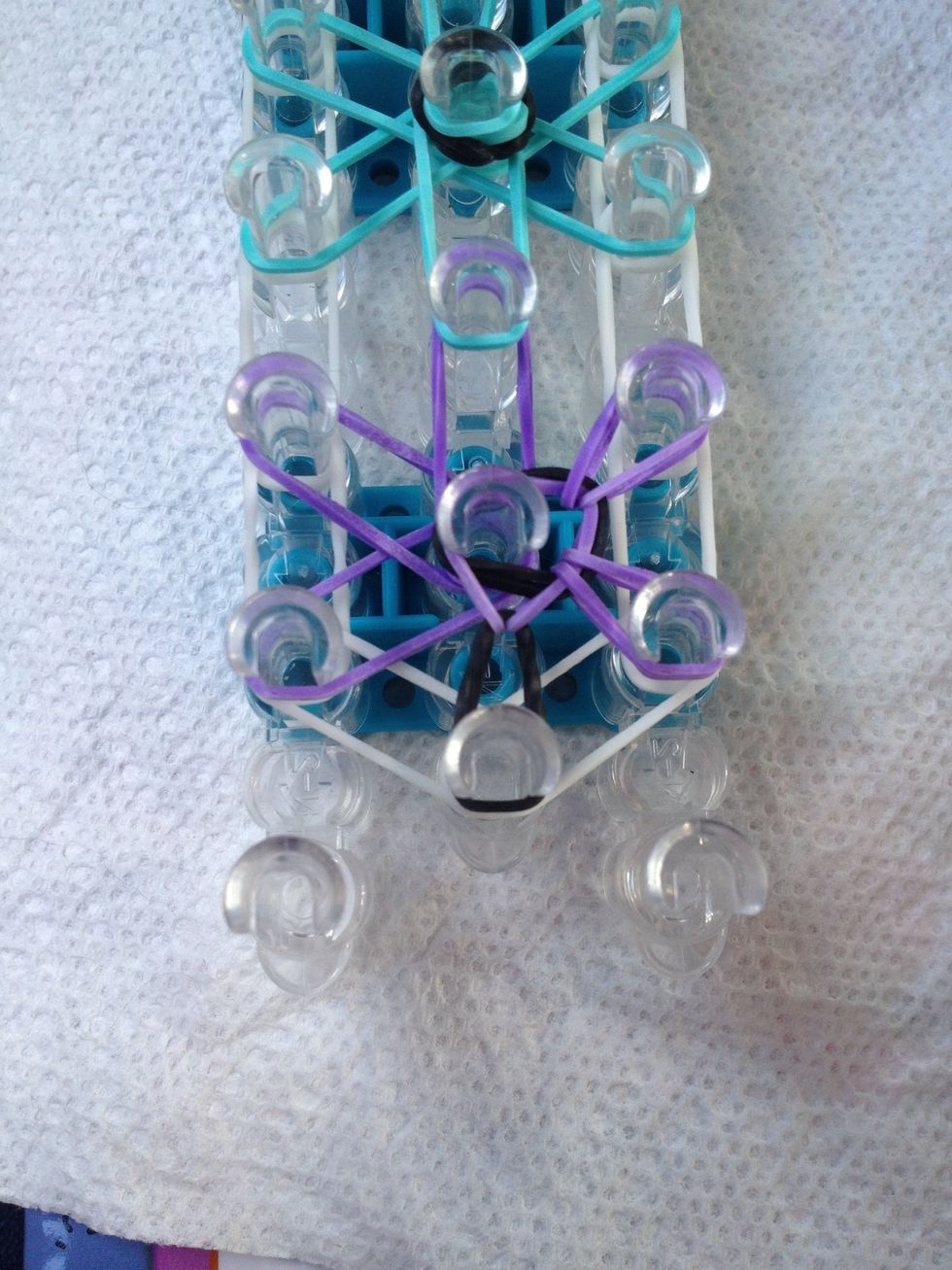 Do the same process again by grabbing the rubber band an pulling it over, COUNTERCLOCKWISE!!!