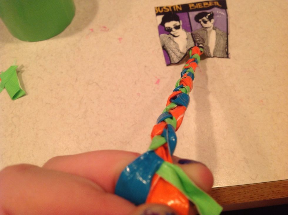 Do the same steps on the other side. Then you are done. To put on wrist add a piece of tape.