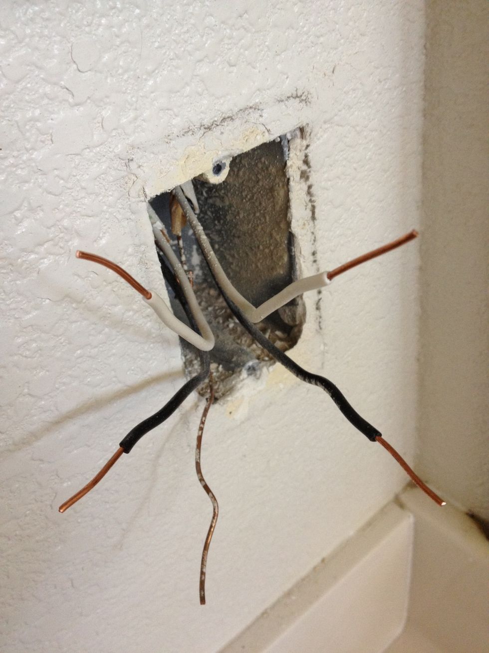 Do the same stripping for all 4 insulated wires. The copper grounding wire is already bare so you're good to go.