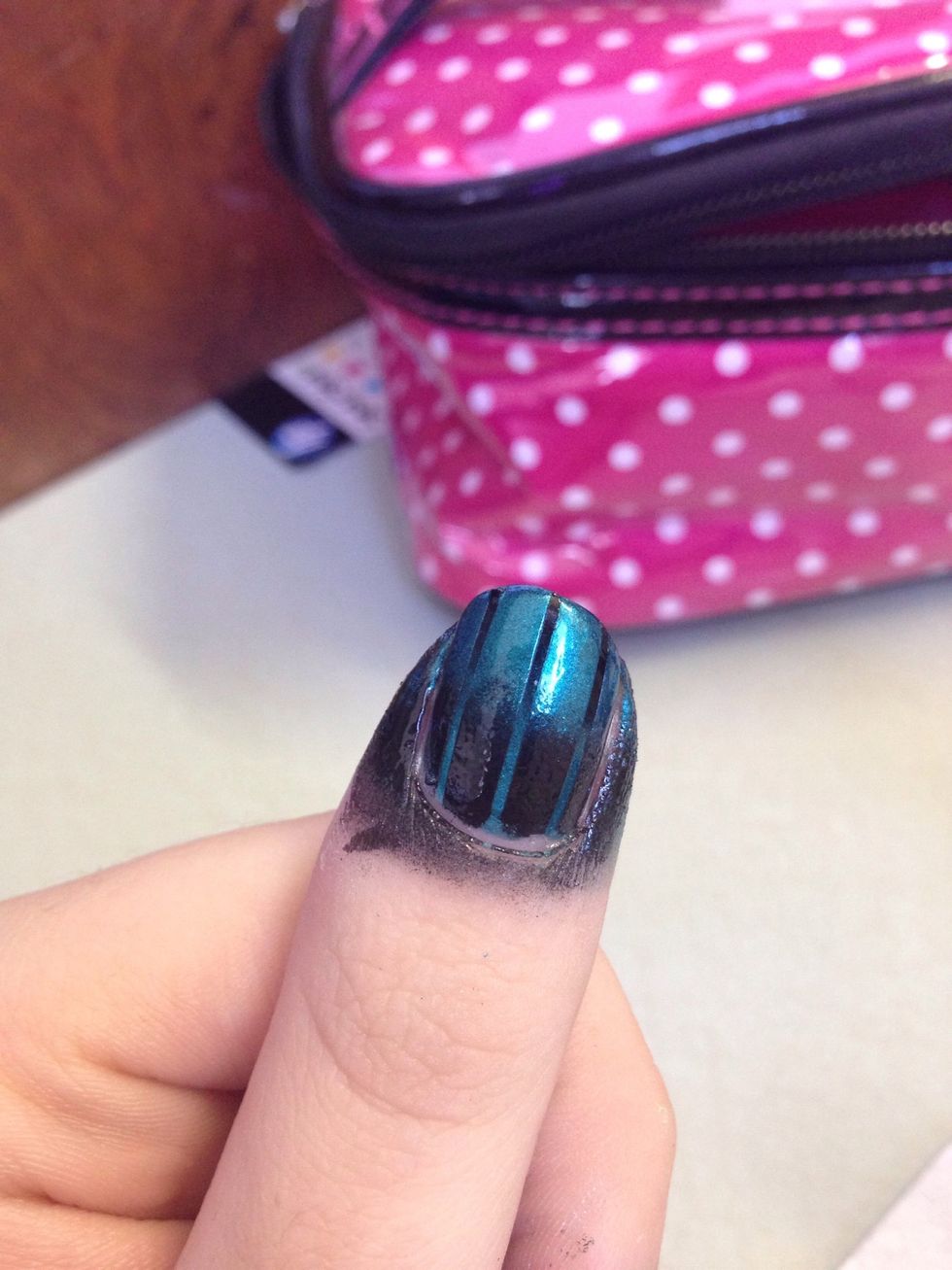 Do the same thing as step 5 but with your colors in the opposite direction. If your tips were black, this time the moons will be black. Peel off the tape to reveal your gradient!