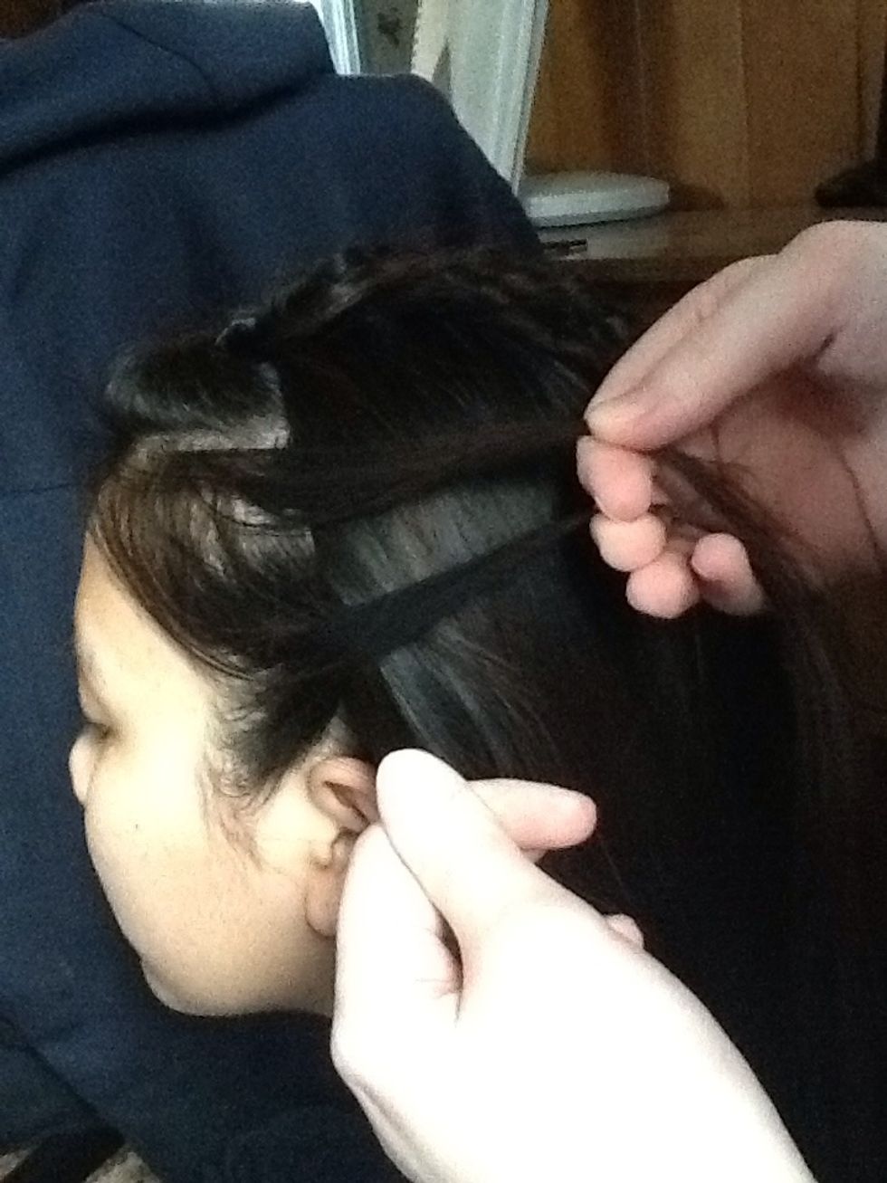 Do the same thing. Take the bottom piece and cross it over the middle piece.