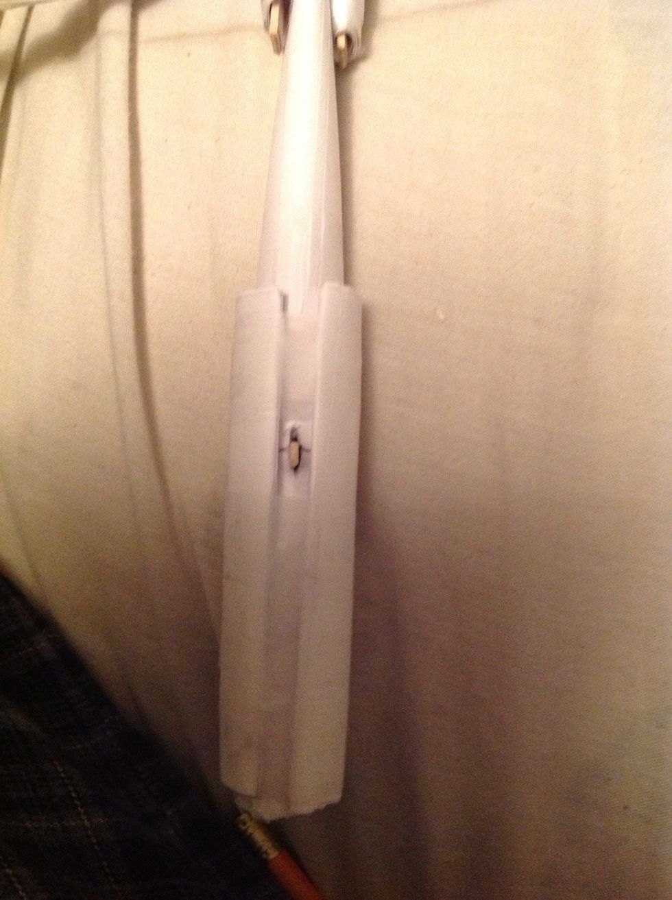 Do the same to the other side and tape it down.