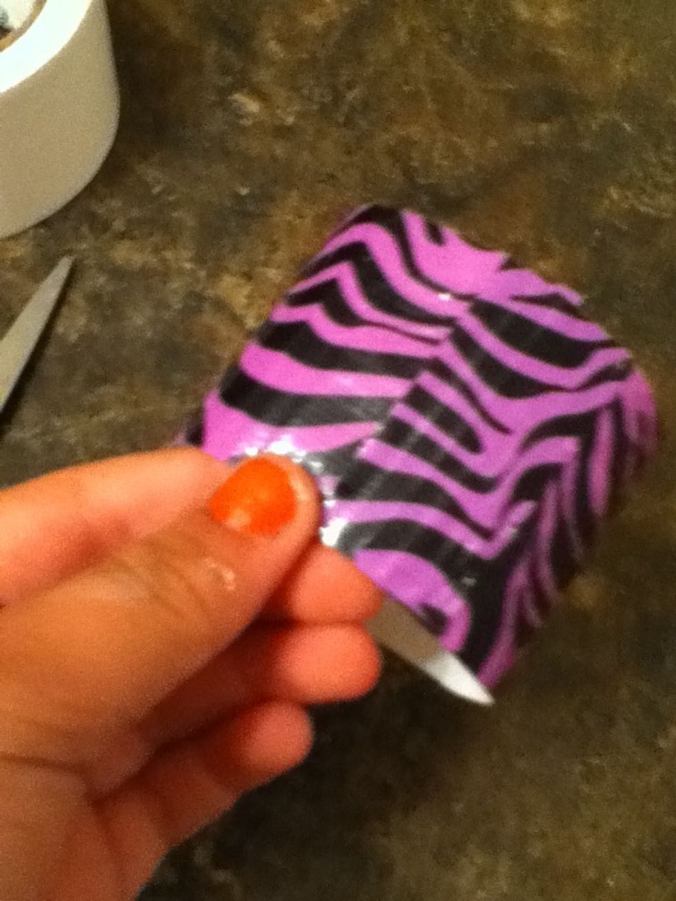 Do the same with another piece of tape like you did in step 8