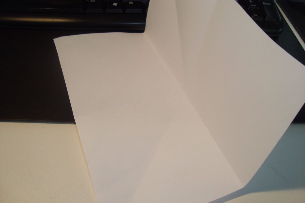 Do the same with both sides so you have a line bisector with the crease.