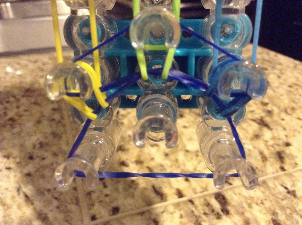 Do the same with the bottom right rubber band