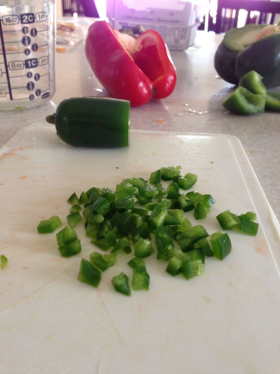 Do the same with the jalape\u00f1o peppers. Don't forget to wash your hands after. You can add more or less depending on how spicy you want them.