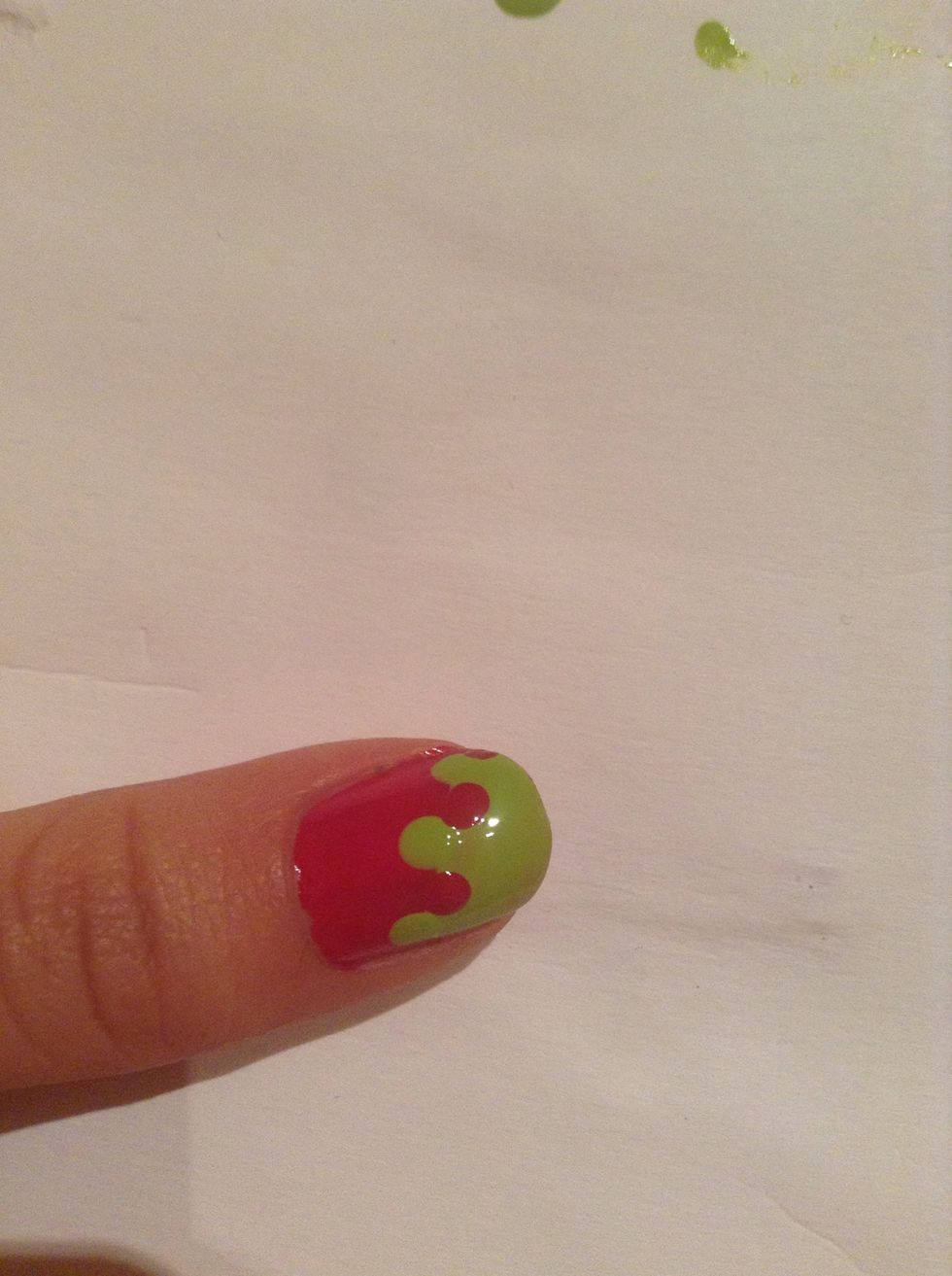 Do the same with the pink, but this time put these dots in between your green dots. You start to get a drippy design.