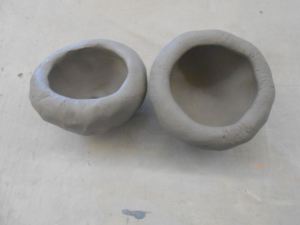 do the same with the second ball of clay.  make both balls the same size pinch pots , if they are uneven it will be difficult to put them together