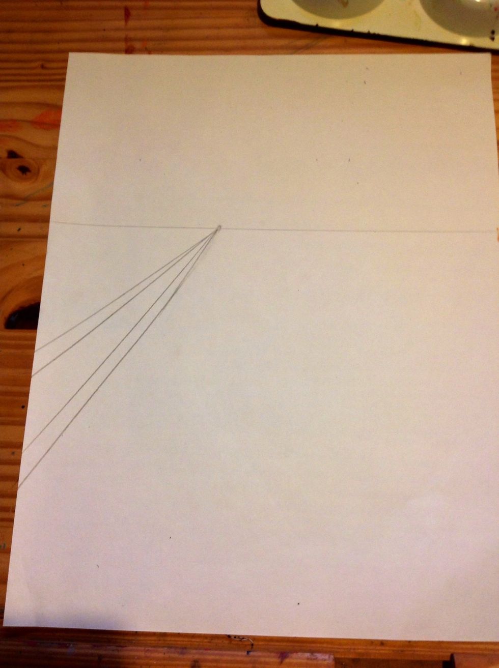 Do this again below the first two lines that you drew. You should now have a total of four lines coming out of the vanishing point.