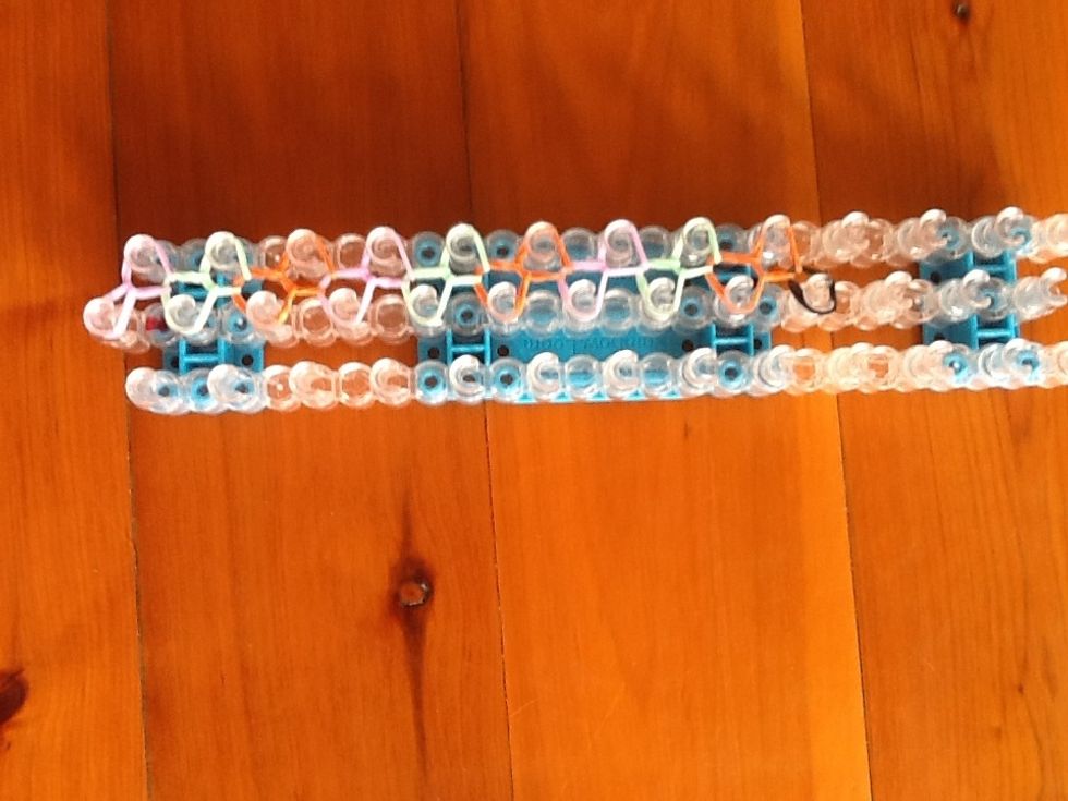 Do this all the way up the loom like this.