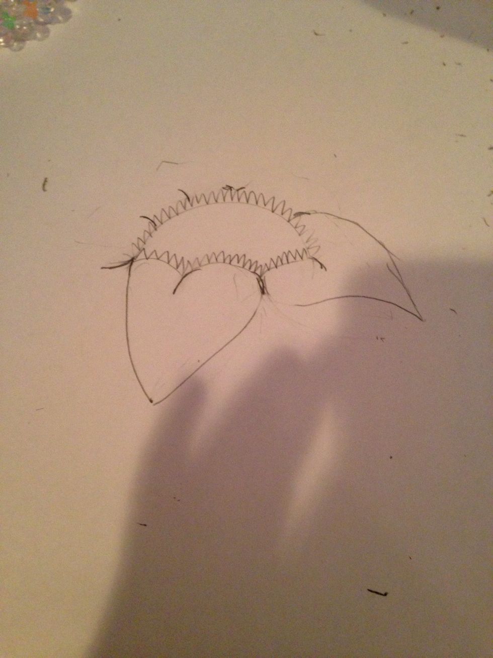 Do this step on the next petal but curved upwards a little more like shown in the picture
