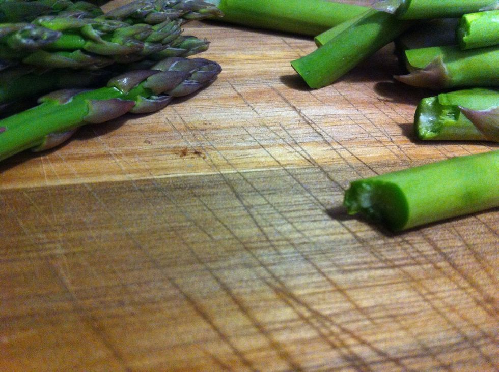 Do this with all of your asparagus; discard the hard ends an rinse the asparagus you will use under cold water